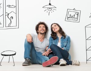 Man and lady sitting on the floor thinking of common questions to ask conveyancer when buying property